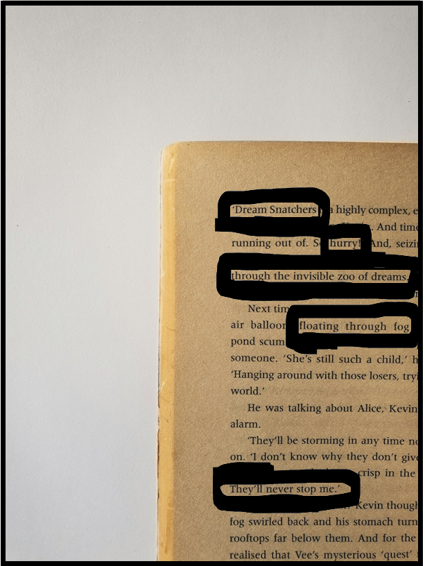 Partially open book with visible text and yellowed pages, inviting learners to engage through the creation of blackout poetry.